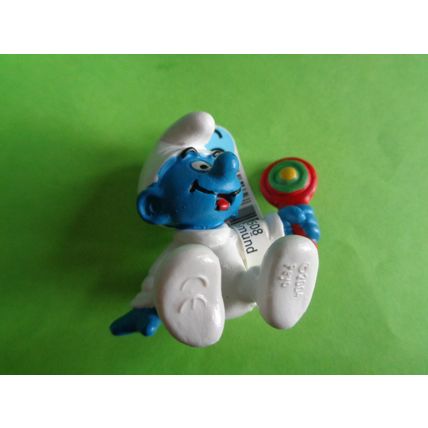 Baby smurf sitting up with rattle and label 2004