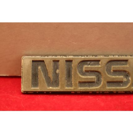 1980’s “Nissan” 3.75” Plastic Rear Trunk Lid Emblem OEM