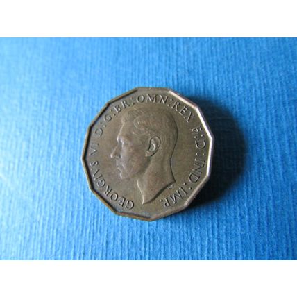1938 GEORGE VI BRASS THREEPENCE.