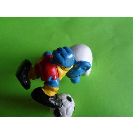 Footballer smurf complete with foot ball