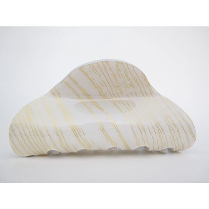 Long creme white blonde and gold hair claw clip