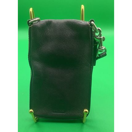 This is a very sweet Plum Color leather Vintage Coach Cellphone Case Pouch