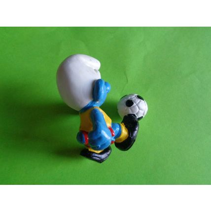 Footballer smurf complete with foot ball