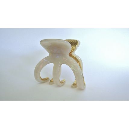 Medium white iridescent gold tone textured acrylic and metal hair claw clip