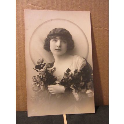 A PRETTY YOUNG GIRL WITH ROSES . unused antique postcard (A)