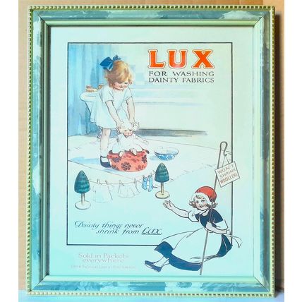 A FRAMED PRINT OF A ' LUX ' ADVERT under glass - 34 x 39 cm FAIR