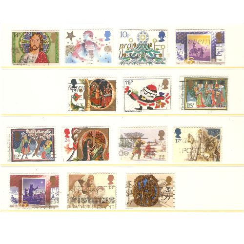 Great Britain 14 Christmas stamps on a large stock card