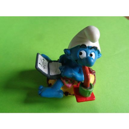 Workaholic smurf with laptop rubber ring and drink