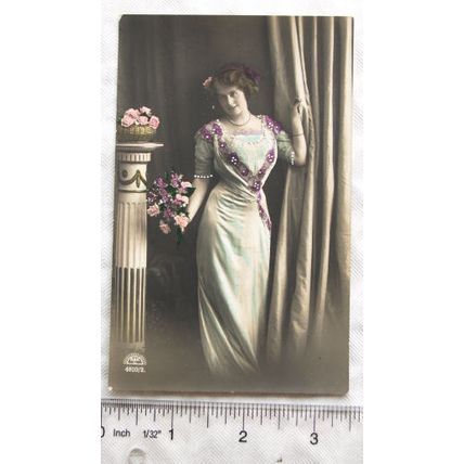 vintage postcard Woman standing by Column