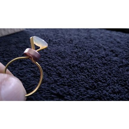 Ethiopian Welo Fire opal and set in gold anodized aluminum setting