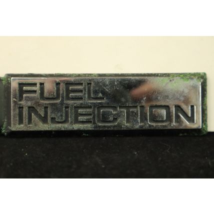 1980-1990 Chevrolet Pontiac Cadillac “2.0 Fuel Injection” Side Emblem OEM