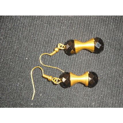 Elegant black crystal glass beads mounted on gold golden coil dangle earrings