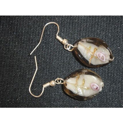 Unconventional white purple gold encased in grey twisted oval glass earring