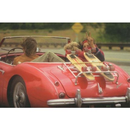 Red Cadillac Sports Car With Extreme Sporting Teenagers Postcard
