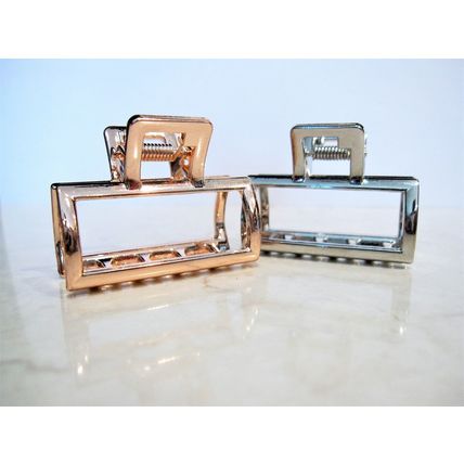 Small rose gold or silver tone metal hair claw clip