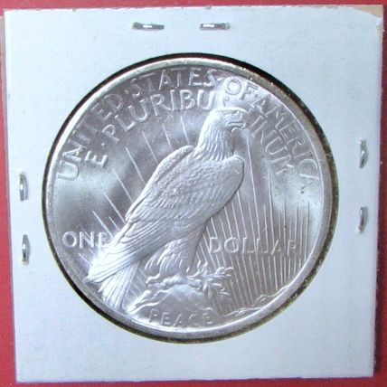 1935 Peace Dollar. This Coin is a replica and contains NO precious metal.