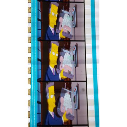 Simpsons Movie. Pk FE FE - 008h. 1 STRIP OF 5 - 35MM FILM CELLS