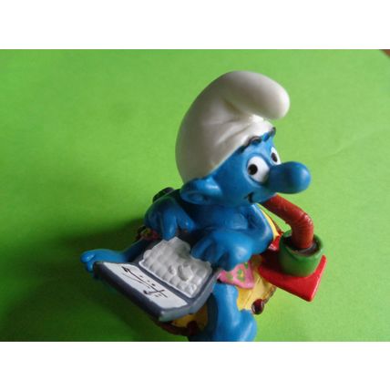 Workaholic smurf with laptop rubber ring and drink