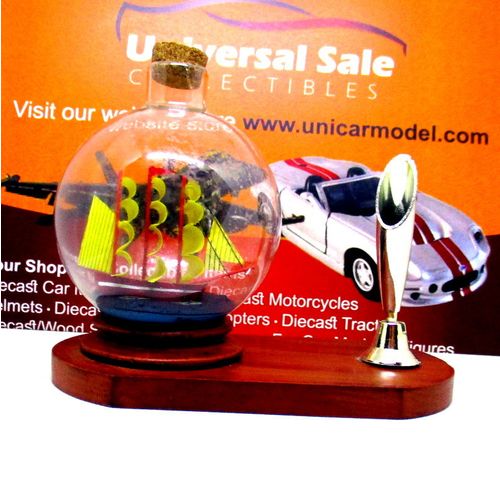 LITTLE SAILING BOAT IN A GLASS BALL ON WOOD PEN STAND,WOODEN NAUTICAL MODEL