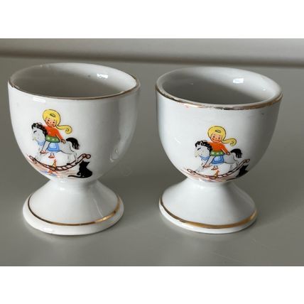 2 X VINTAGE EGG CUPS - GIRL ON ROCKING HORSE