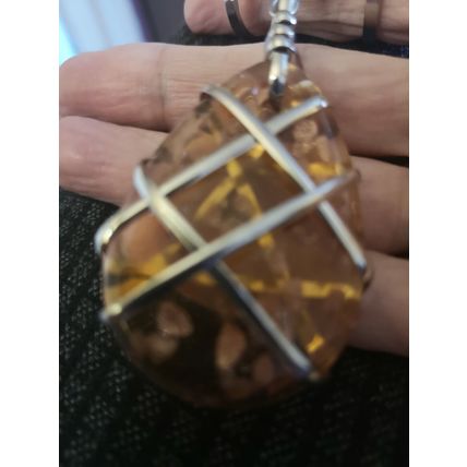 Interesting Pale Orange Glitter Pendant With Metal Detail