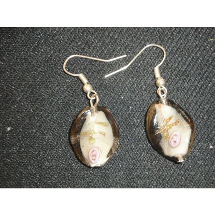 Unconventional white purple gold encased in grey twisted oval glass earring