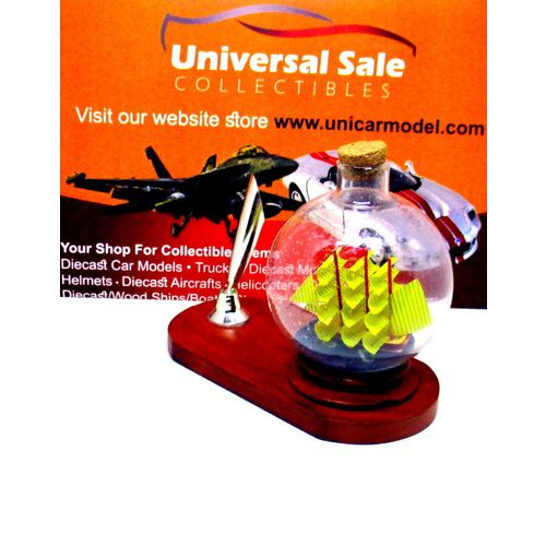 LITTLE SAILING BOAT IN A GLASS BALL ON WOOD PEN STAND,WOODEN NAUTICAL MODEL