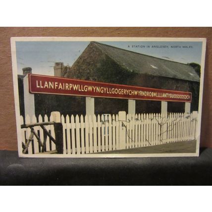 A STATION IN ANGLESEY, WALES used vintage postcard .. by E T W Dennis 1962 pm