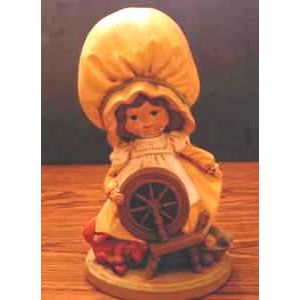 Ceramic Girl with Big Yellow Hat with Spinning Wheel :: FREE Shipping