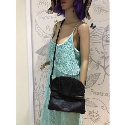 Kate Hill crossbody women's black handbag. Can be folded