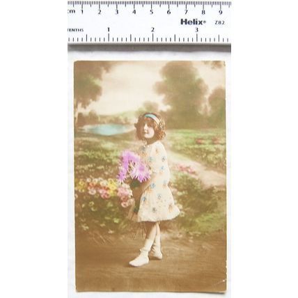 1918 coloured postcard - Girl Holding Flowers