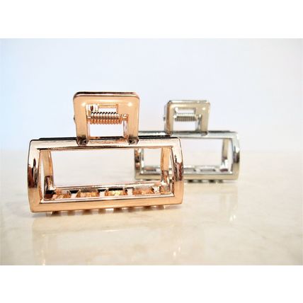 Small rose gold or silver tone metal hair claw clip