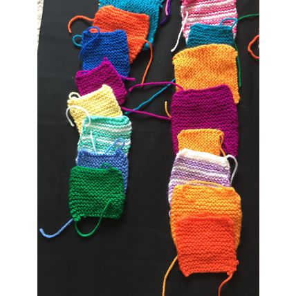 50 knitted squares in Various Colours Sizes.