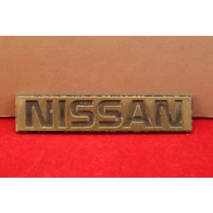 1980’s “Nissan” 3.75” Plastic Rear Trunk Lid Emblem OEM