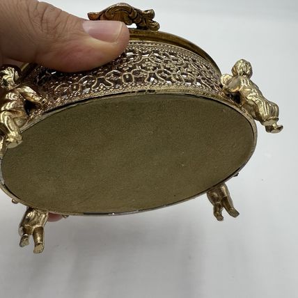 Vintage Gold Filigree Oval Ormolu casket Hollywood Regency style Cherubs Footed