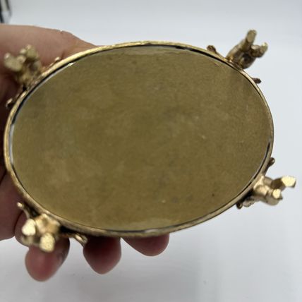 Vintage Gold Filigree Oval Ormolu casket Hollywood Regency style Cherubs Footed