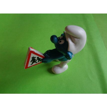 Smurf with a children crossing traffic safety sign
