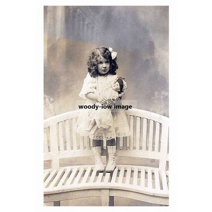 rp10531 - Young Girl on a seat with her Doll - print 6x4