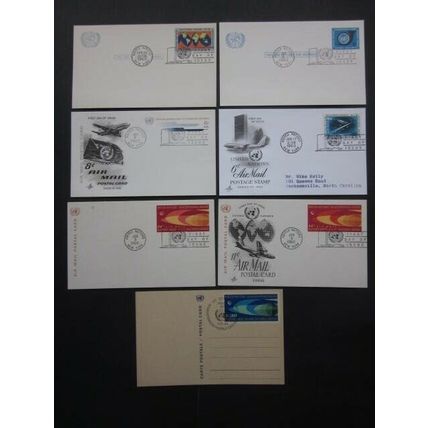 A1960's GROUP OF SEVEN UNITED NATIONS POSTAL CARDS WITH F.D.I. POSTMARKS.(02227)