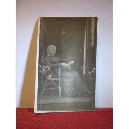 UNKNOWN ELDERLY LADY READING IN A RATTAN CHAIR, antique photograph postcard =