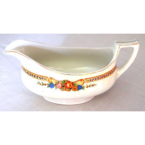 Gravy sauce boat circa 1920 with Grecian floral pattern see matching plates