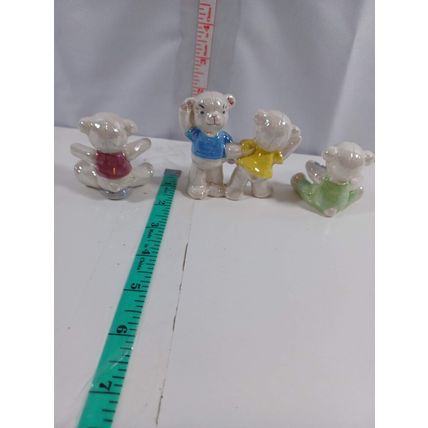 set of 4 handcrafted cermic bears 2 inches very cute used very nice