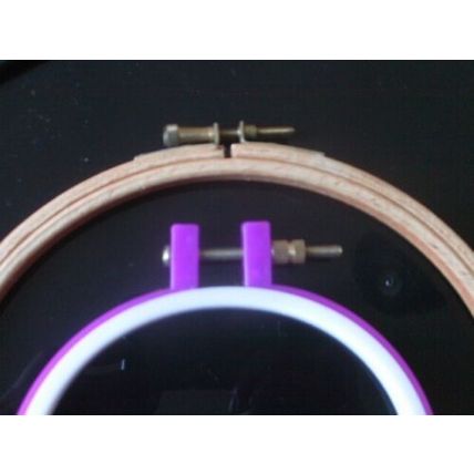 2 embroidery hoops, 1 wooden, 1 plastic
