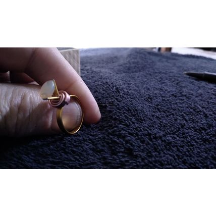 Ethiopian Welo Fire opal and set in gold anodized aluminum setting