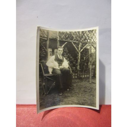 A MAN AND TWO WHITE RABBITS, 1930s? photograph =