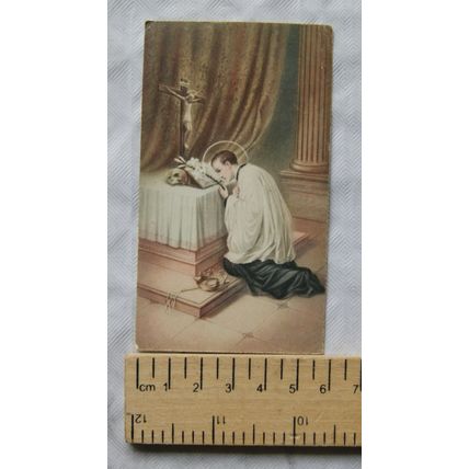 Vintage illustrated card - saint kneeling at altar