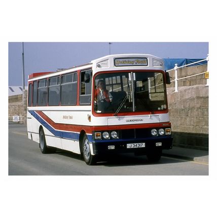 pu1025 - Holiday Coach Tours reg no J34317 at St Helier - photograph 6x4