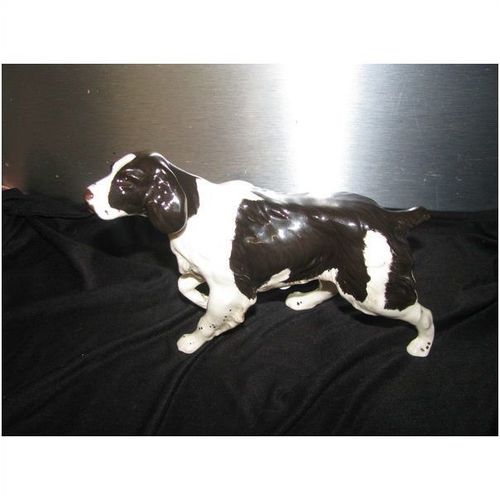 Beswick dog spaniel ? 7" long. inspection ticket on base fully marked.