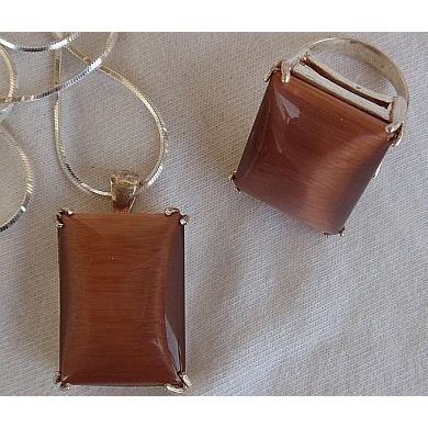 A brown cat eye set ring and pendant