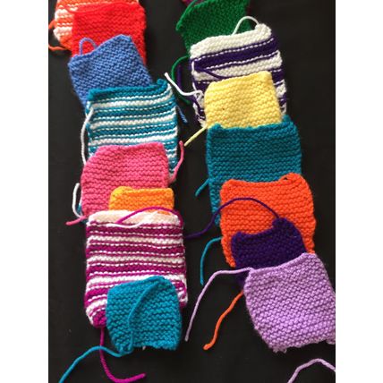 50 knitted squares in Various Colours Sizes.